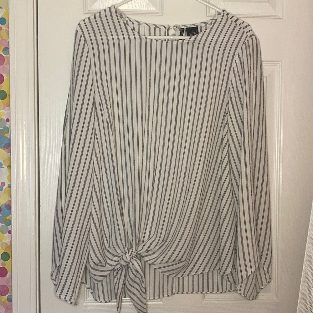 Long sleeve blouse with slits down the sleeves.
